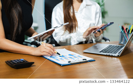 Business team meeting. professional investor working new start up project. Finance task. with smart phone and laptop and digital tablet computer Business team meeting. professional investor working new start up project. Finance task. with smart phone and laptop and digital tablet computer 133464122