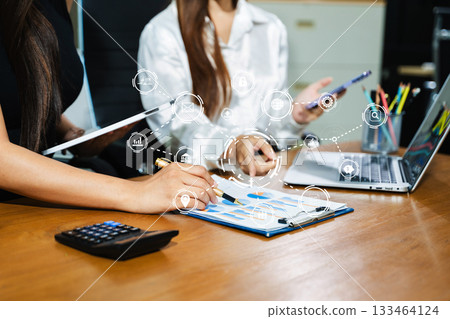 Working team meeting concept, business using laptop and smart phone and digital tablet computer with digital marketing media in virtual icon network diagram office Working team meeting concept, business using laptop and smart phone and digital tablet computer with digital marketing media in virtual icon network diagram office 133464124