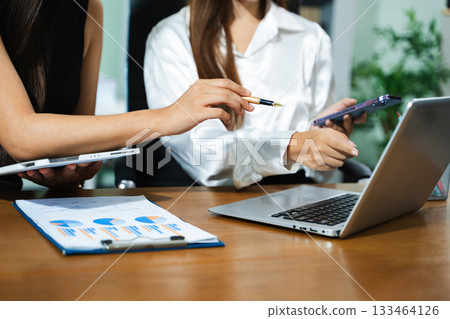 Business team meeting present.professional investor working with  Finance managers task. with laptop smart phone and digital tablet 133464126