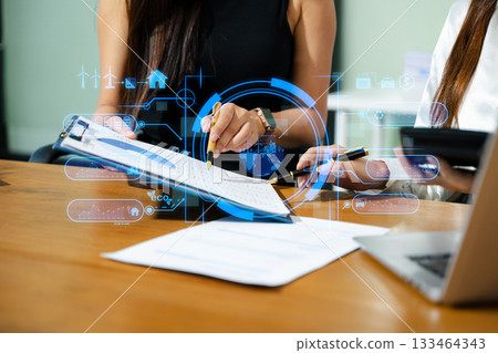 Business team working virtual modern smartphone to reduce CO2 emissions carbon footprint climate change to limit global warming.Sustainable development and green business concept. Business team working virtual modern smartphone to reduce CO2 emissions carbon footprint climate change to limit global warming.Sustainable development and green business concept. 133464343
