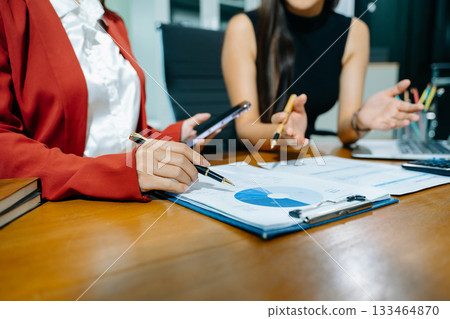 Business team meeting present.professional investor working with Finance managers task. with laptop smart phone and digital tablet Business team meeting present.professional investor working with Finance managers task. with laptop smart phone and digital tablet 133464870