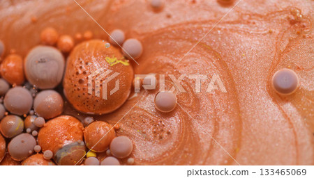 Spill background. Paint drop. Blur orange purple yellow color bubbles fluid sparkling oil glitter pigment floating on acrylic abstraction. Spill background. Paint drop. Blur orange purple yellow color bubbles fluid sparkling oil glitter pigment floating on acrylic abstraction. 133465069
