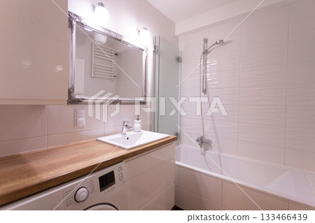 Stylish and Contemporary Modern Bathroom Interior Featuring a Luxurious Bath and Sink 133466439