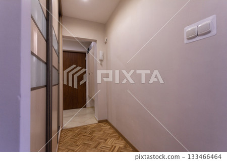A Modern Hallway Ambiance Featuring Beautiful Wooden Elements and Soft, Inviting Lighting 133466464