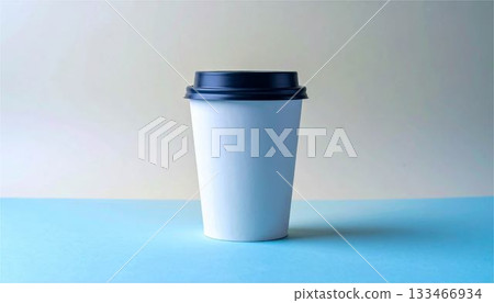 White paper coffee cup mockup with lid placed on a pastel yellow and blue background White paper coffee cup mockup with lid placed on a pastel yellow and blue background 133466934