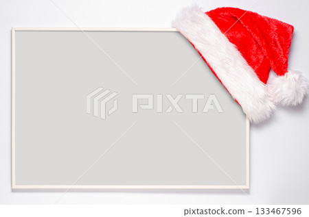 An empty record frame with a Santa hat. The concept of planning for the new year. 133467596