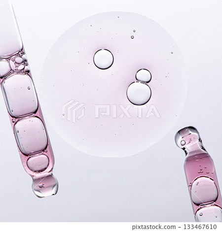 Skin serum in a pipette. A cosmetic product for body care. White background. 133467610