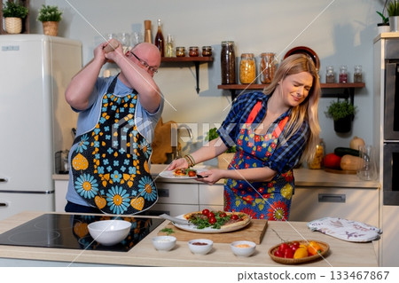 Cooking Together Enjoying Fun and Memorable Moments in the Kitchen with Friends and Family Cooking Together Enjoying Fun and Memorable Moments in the Kitchen with Friends and Family 133467867