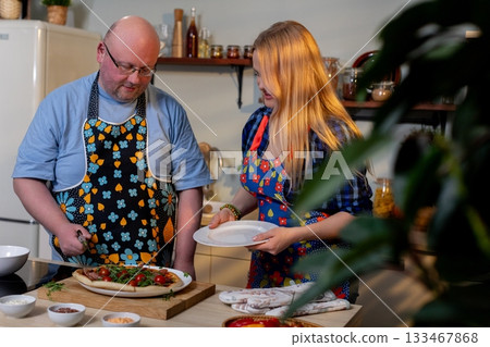 Cooking Together Enjoying a Joyful Meal Preparation Experience in a Cozy Kitchen Space 133467868