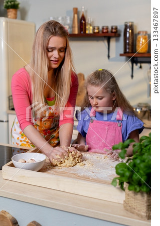 Cooking Together A Joyful Moment in the Kitchen Historically Filled with Love and Laughter Cooking Together A Joyful Moment in the Kitchen Historically Filled with Love and Laughter 133467897