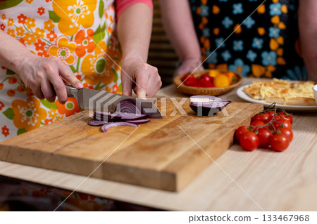 Chopping Fresh and Vibrant Vegetables in a Colorful and Inviting Kitchen Setting, Ideal for Cooking 133467968
