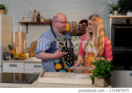 Chefs enthusiastically Preparing a Wide variety of Delicious Food in a Bright Kitchen space Chefs enthusiastically Preparing a Wide variety of Delicious Food in a Bright Kitchen space 133467973