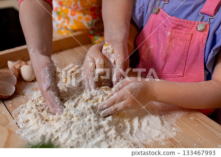 Baking Together A Joyful Cooking Moment Filled with Flour, Hands, and Happiness Galore 133467993
