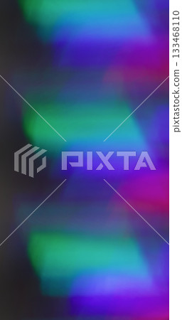 Fluorescent blur glow. Futuristic flare. Purple blue green kaleidoscope effect on black background. Neon color abstract luminosity. 133468110