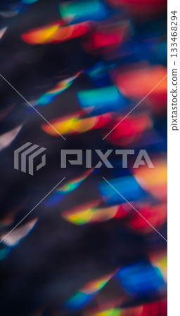 Bokeh gradient lens. Kaleidoscopic light. Red blue yellow glimmer leak on black background. Optical bright color defocused art reflection. Bokeh gradient lens. Kaleidoscopic light. Red blue yellow glimmer leak on black background. Optical bright color defocused art reflection. 133468294