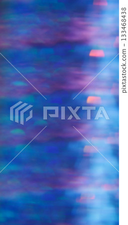 Defocused crystal flash. Shimmering glow texture. Rainbow bokeh light mix color. Prism sparks abstract purple blue neon background. Defocused crystal flash. Shimmering glow texture. Rainbow bokeh light mix color. Prism sparks abstract purple blue neon background. 133468438
