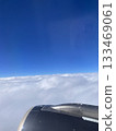 High-altitude cloud sea and blue sky viewing angle | Overhead view of the airplane mouth skyscape | General sky cloud layer 133469061