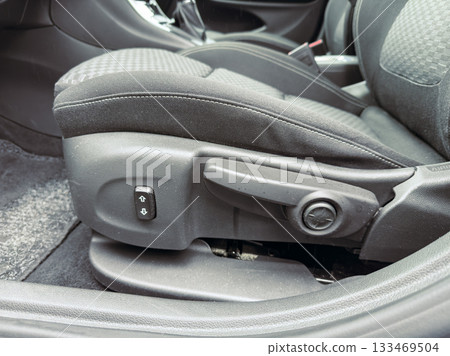 Comfort features enhance the driving experience in a modern car interior with adjustable seating Comfort features enhance the driving experience in a modern car interior with adjustable seating 133469504
