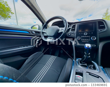 Exploring modern automotive design in a sleek, stylish interior with contemporary features and a comfortable cabin ambiance 133469691