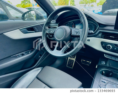 Driving experience captured in a modern car interior with sleek design and advanced technology 133469693