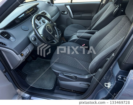 Comfortable interior of a compact car showcasing modern design and functionality with spacious seating for passengers Comfortable interior of a compact car showcasing modern design and functionality with spacious seating for passengers 133469728