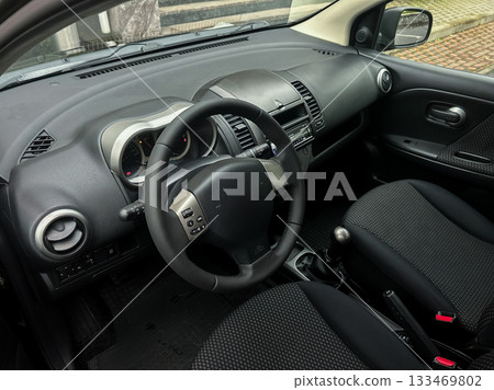 Exploring the interior design and features of a modern car during a quiet afternoon Exploring the interior design and features of a modern car during a quiet afternoon 133469802