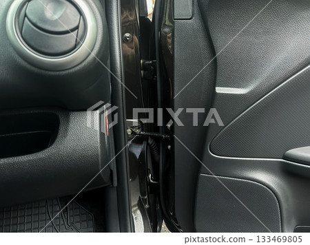 Exploring the intricate design and engineering of a car door's interior at an auto show 133469805