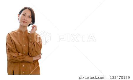 Earphones - Woman listening to music or the radio (large) 133470129