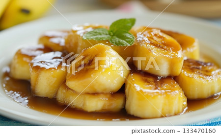 Banana foster with cinnamon and caramel sauce Banana foster with cinnamon and caramel sauce 133470160