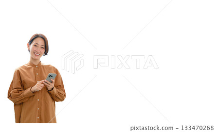 A woman using a phone by the window (center) 133470268