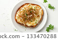 Toasted loaf bread melted cheese caramelized simple lunch on white plate 133470288