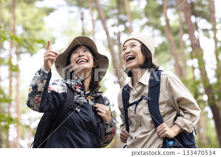 Woman taking a walk in nature Woman taking a walk in nature 133470534