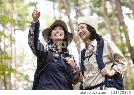 Woman taking a walk in nature Woman taking a walk in nature 133470536