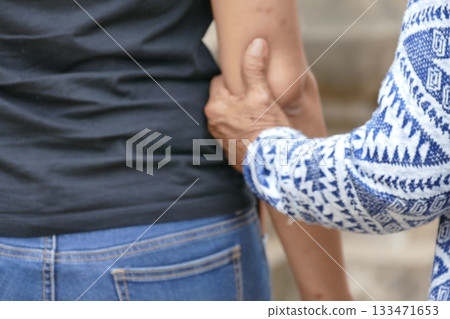 Asian senior or elderly old lady woman patient hold hand on her chest with love and care, healthy strong medical concept. Asian senior or elderly old lady woman patient hold hand on her chest with love and care, healthy strong medical concept. 133471653