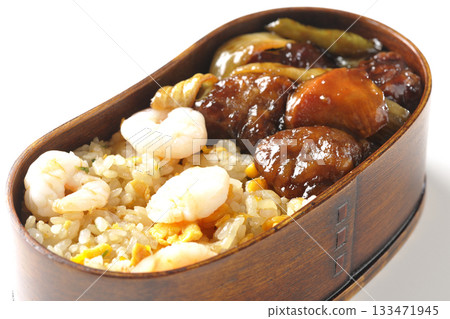 Shrimp fried rice and black vinegar sweet and sour pork bento photographed on a white background Shrimp fried rice and black vinegar sweet and sour pork bento photographed on a white background 133471945