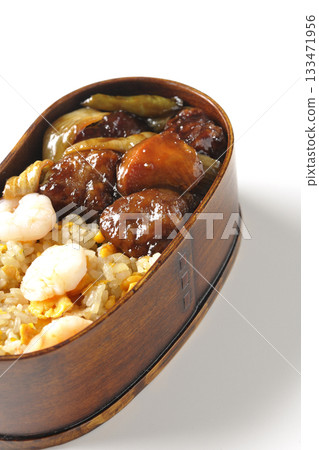 Shrimp fried rice and black vinegar sweet and sour pork bento photographed on a white background Shrimp fried rice and black vinegar sweet and sour pork bento photographed on a white background 133471956