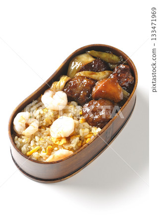 Shrimp fried rice and black vinegar sweet and sour pork bento photographed on a white background 133471969