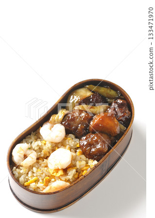 Shrimp fried rice and black vinegar sweet and sour pork bento photographed on a white background 133471970