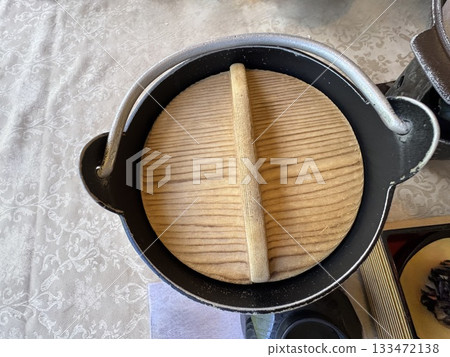 A hearth pot with a wooden lid A hearth pot with a wooden lid 133472138