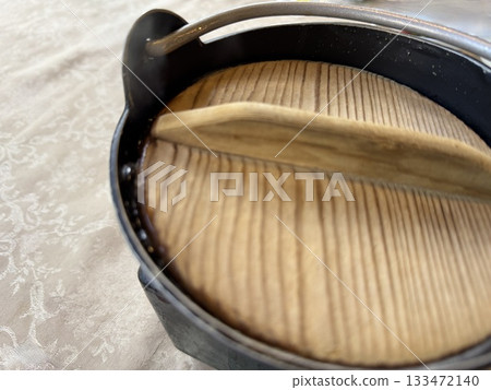 A hearth pot with a wooden lid A hearth pot with a wooden lid 133472140