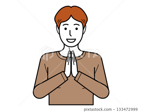 Facing the front. A young man in a T-shirt clasping his hands together and saying "itadakimasu" (thank you for the meal). Facing the front. A young man in a T-shirt clasping his hands together and saying "itadakimasu" (thank you for the meal). 133472999