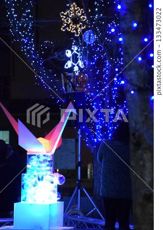 A paper crane object that prays for peace, lit up in the winter city illuminations (December/End of the Year street lights) 133473022