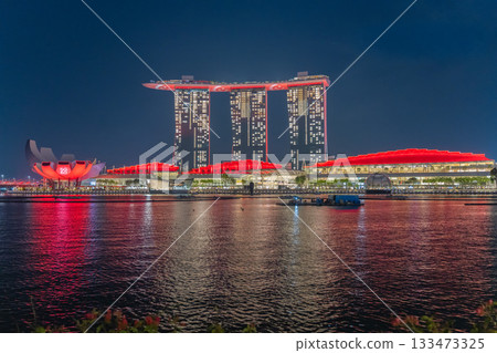 Marina Bay Sands, Singapore lit up in the red colours of the national flag on National Day 133473325