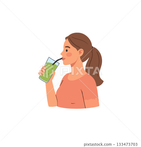 Woman enjoying a refreshing green smoothie for healthy living and wellness in a bright setting 133473703