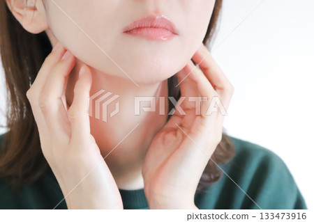 Woman touching her neck, lymphatic care, massage Woman touching her neck, lymphatic care, massage 133473916