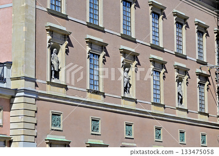Statues decorating the windows of the Royal Palace in Stockholm 133475058