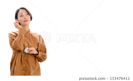 Woman listening to music or radio (large) 133476411