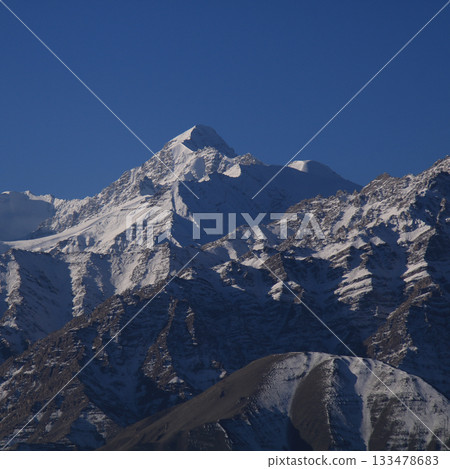 Stok Kangri, high mountain of the Zanskar Range seen from Leh, India. 133478683