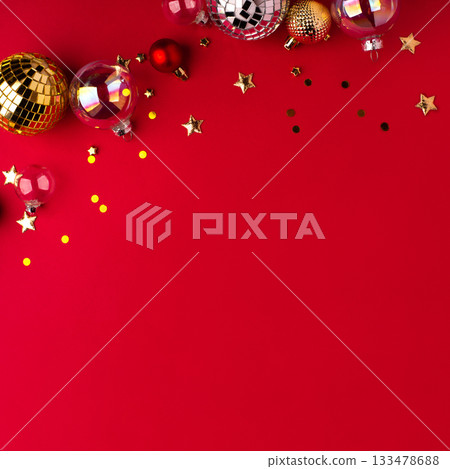 Festive Christmas ornaments on a red background. 133478688