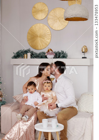 Family celebration in cozy living room with children during festive season Family celebration in cozy living room with children during festive season 133478953